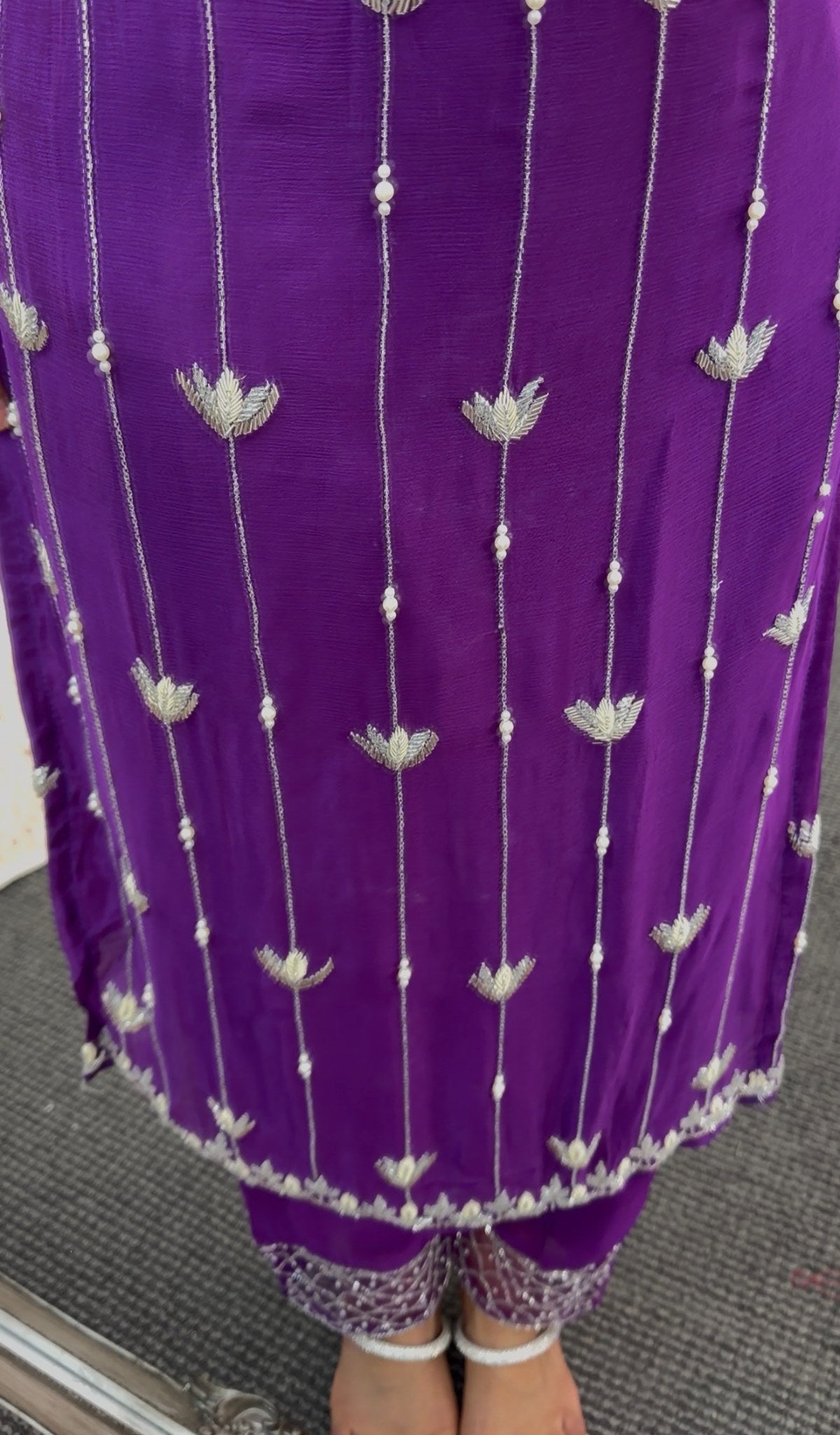 Purple kurti set with white floral embroidery, matching dupatta and embellished pants draped on model — view 4