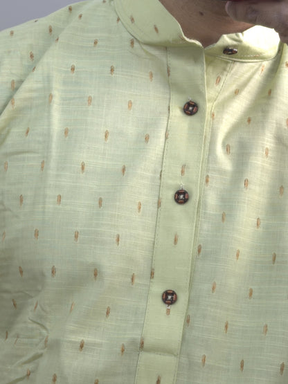 Pista green men's kurti with mandarin collar, printed motifs and button placket paired with white pants — view 2
