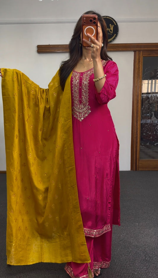 Fuchsia crepe silk kurti set with gold zari embroidery at neckline, matching trousers and mustard floral dupatta — Behuli