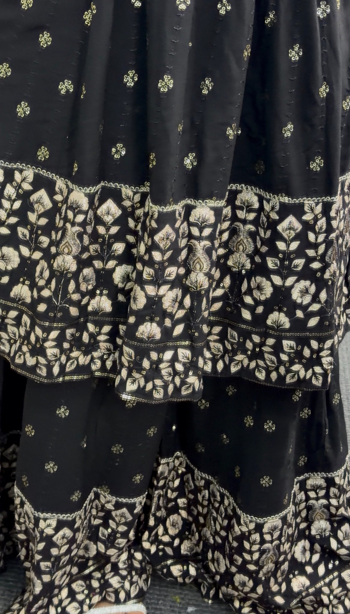 Black and gold Anarkali sharara set with zari floral embroidery, tiered embroidered hem and matching sheer dupatta — Behuli — view 4