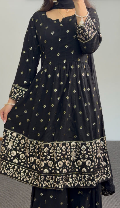 Black and gold Anarkali sharara set with zari floral embroidery, tiered embroidered hem and matching sheer dupatta — Behuli — view 5