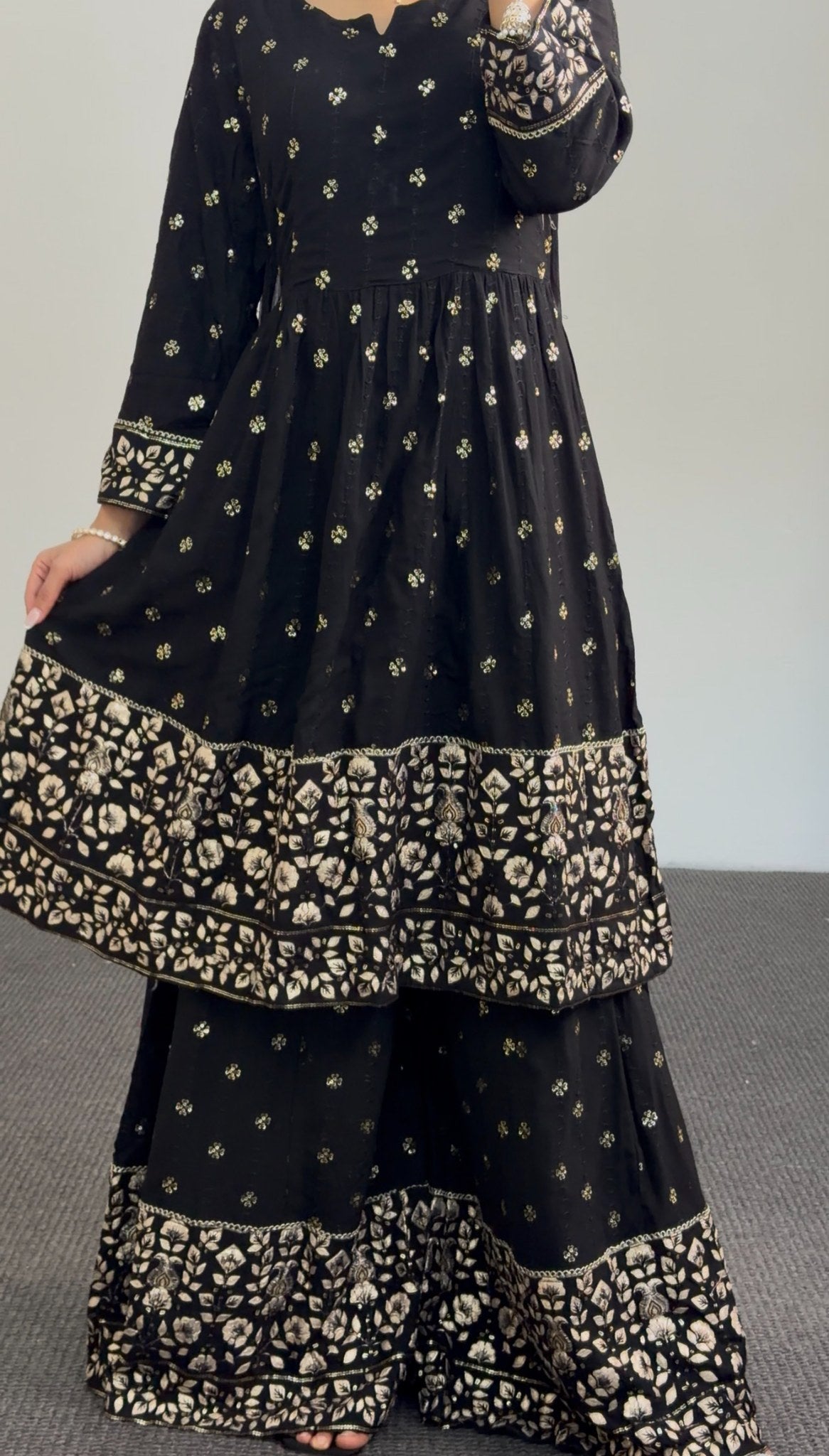 Black and gold Anarkali sharara set with zari floral embroidery, tiered embroidered hem and matching sheer dupatta — Behuli — view 6