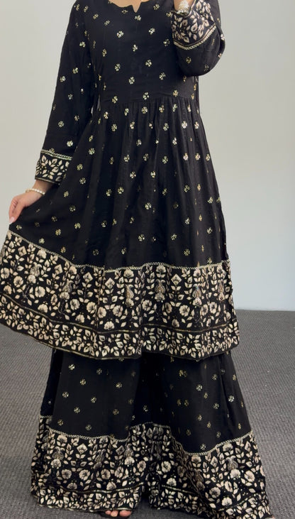 Black and gold Anarkali sharara set with zari floral embroidery, tiered embroidered hem and matching sheer dupatta — Behuli — view 6