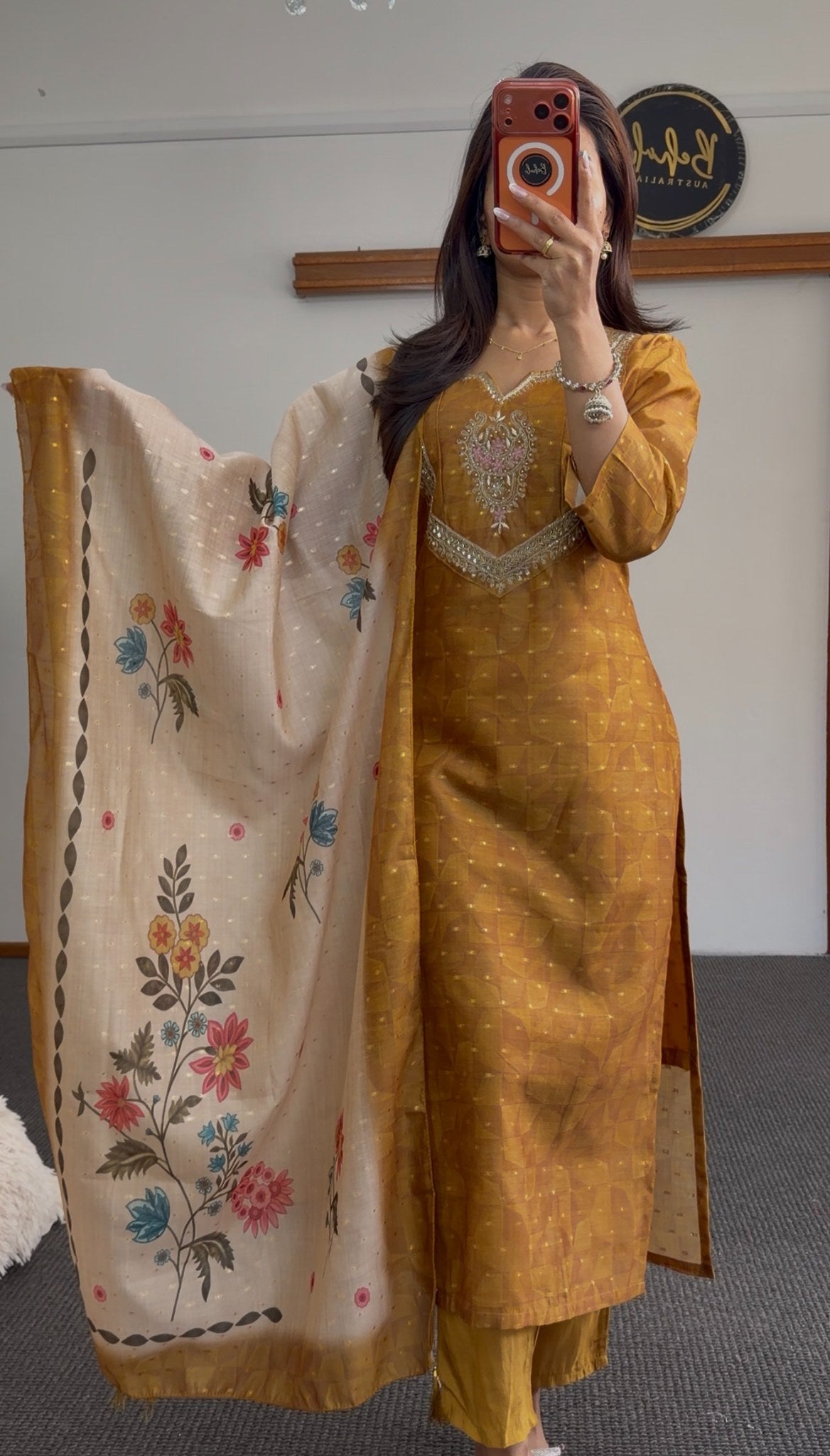 Mustard kurti set with sequin and mirror neckline embellishment, matching palazzo pants, and ivory floral printed dupatta —