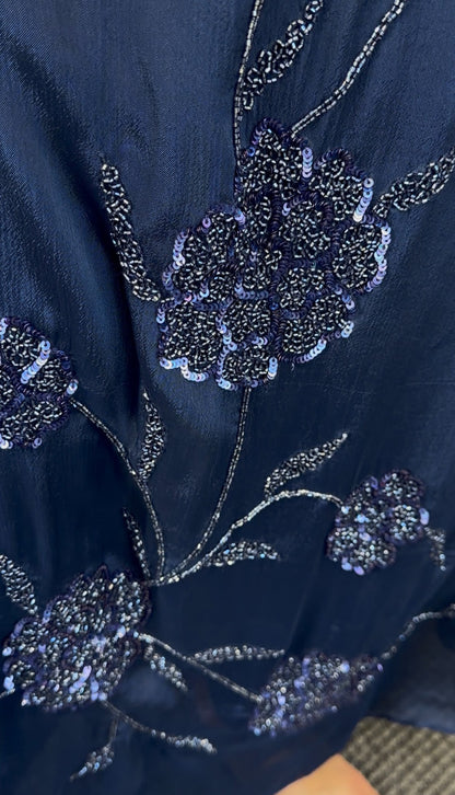Navy blue A-line kurti set with floral sequin embroidery cascading down the front and matching draped scarf — view 3