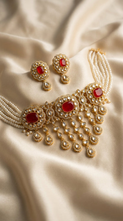 Red and gold Kundan-style choker necklace and earring jewellery set with pearl bead strands and teardrop pendants — Behuli