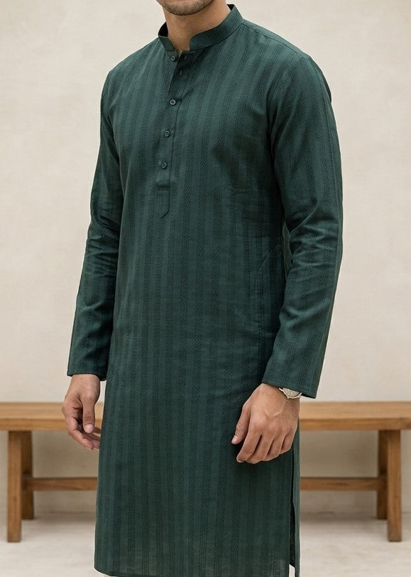 Bottle green men's kurta with mandarin collar and subtle woven texture, paired with cream trousers and brown shoes — view 2