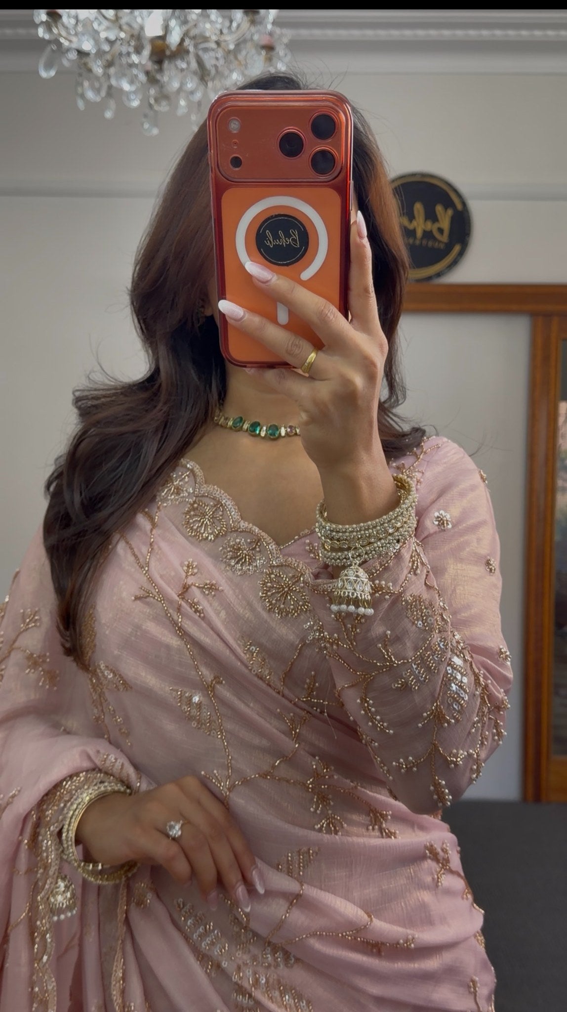 Blush pink chiffon saree with gold sequin embroidery and scalloped border draped in traditional style — view 2