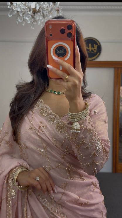 Blush pink chiffon saree with gold sequin embroidery and scalloped border draped in traditional style — view 2