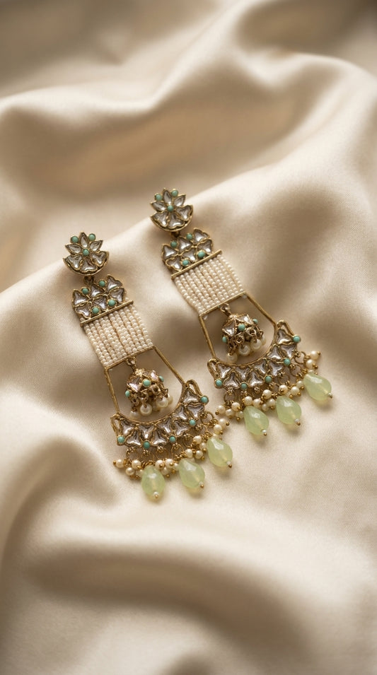 Ivory and mint green kundan-style chandbali earrings with seed pearl panels and faceted bead drops on cream silk — Behuli