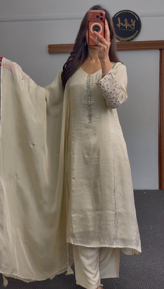 Ivory A-line kurti set with mirror work embroidered sleeves, embellished placket, and matching flowing dupatta