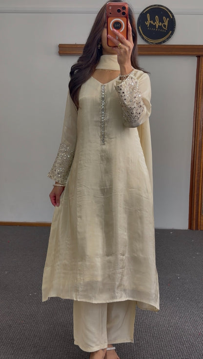 Ivory A-line kurti set with mirror work embroidered sleeves, embellished placket, and matching flowing dupatta — view 3