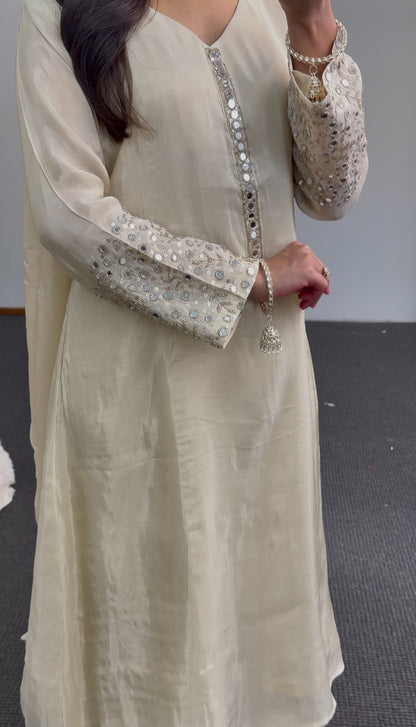 Ivory A-line kurti set with mirror work embroidered sleeves, embellished placket, and matching flowing dupatta — view 4