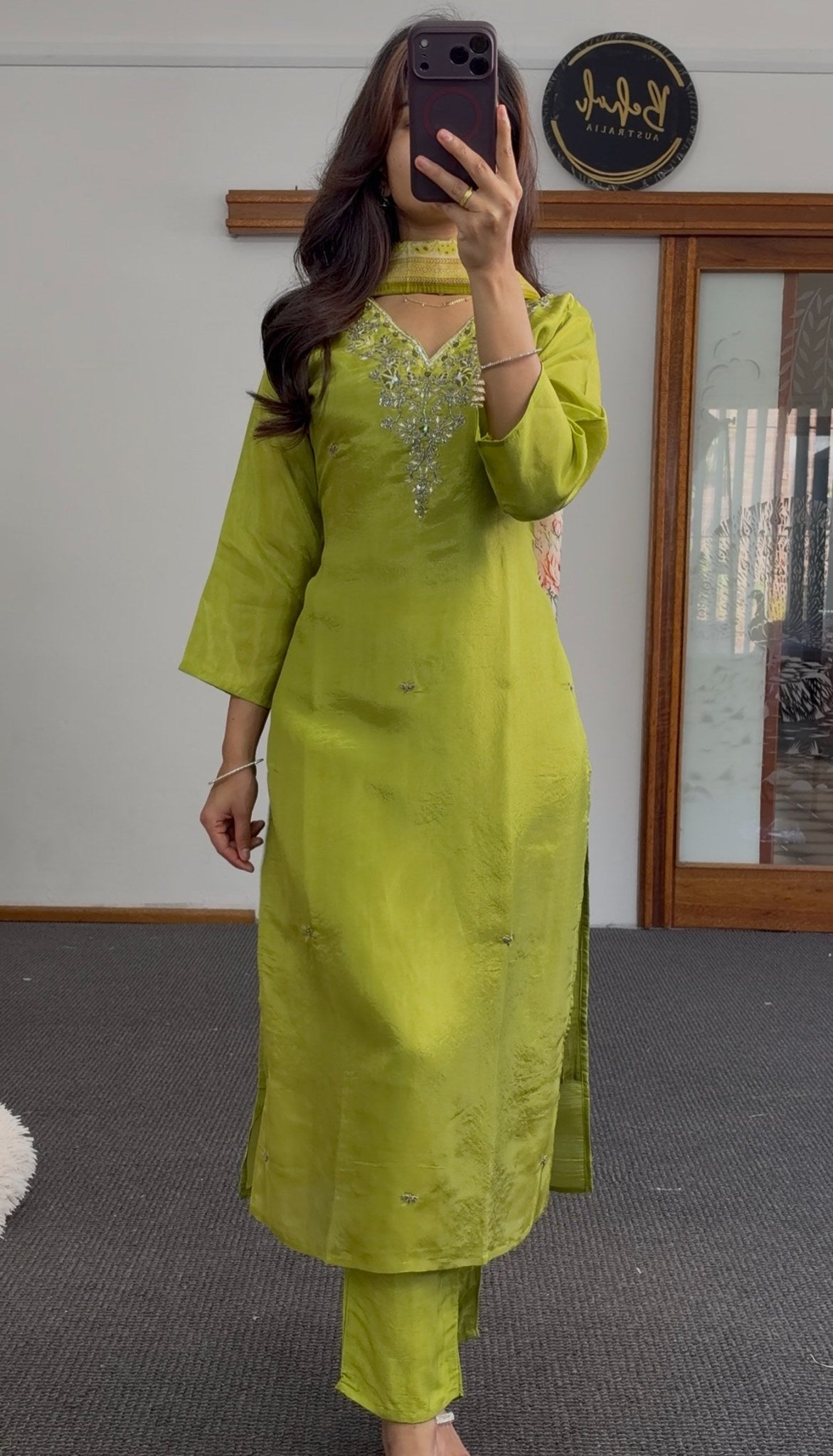 Lime green kurti set with embroidered stonework neckline, choker collar detail, and matching straight-leg pants