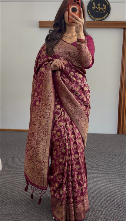Maroon saree with gold zari floral weave, pallu draped over shoulder, worn with matching maroon blouse — view 2