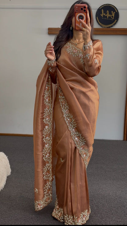 Copper satin saree with floral embroidered border and sequin detailing draped over shoulder — Behuli Australia