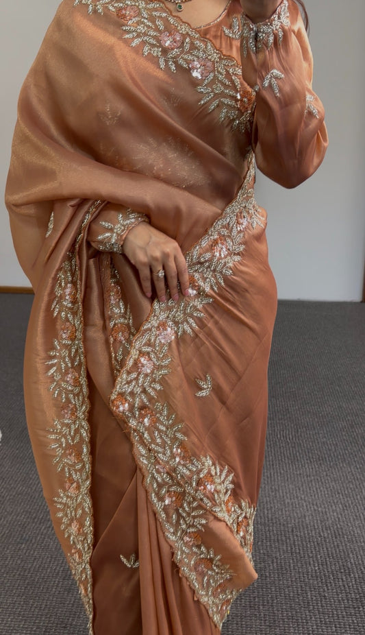 Copper satin saree with floral embroidered border and sequin detailing draped over shoulder — Behuli Australia — view 2