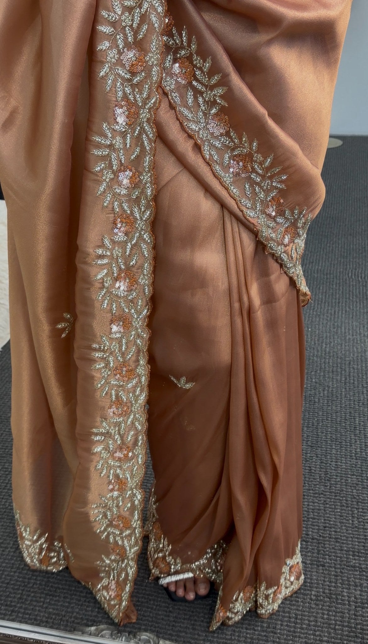 Copper satin saree with floral embroidered border and sequin detailing draped over shoulder — Behuli Australia — view 4