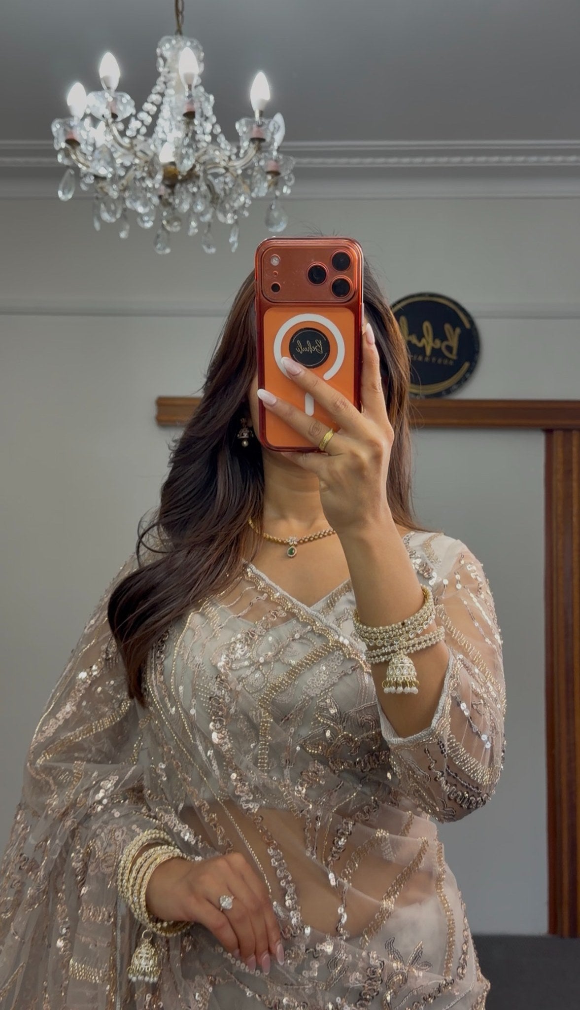 Grey net saree with gold sequin embroidery and embellished pallu draped over matching underskirt — Behuli Australia — view 2