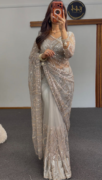 Grey net saree with gold sequin embroidery and embellished pallu draped over matching underskirt — Behuli Australia — view 3