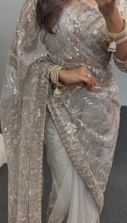 Grey net saree with gold sequin embroidery and embellished pallu draped over matching underskirt — Behuli Australia — view 4
