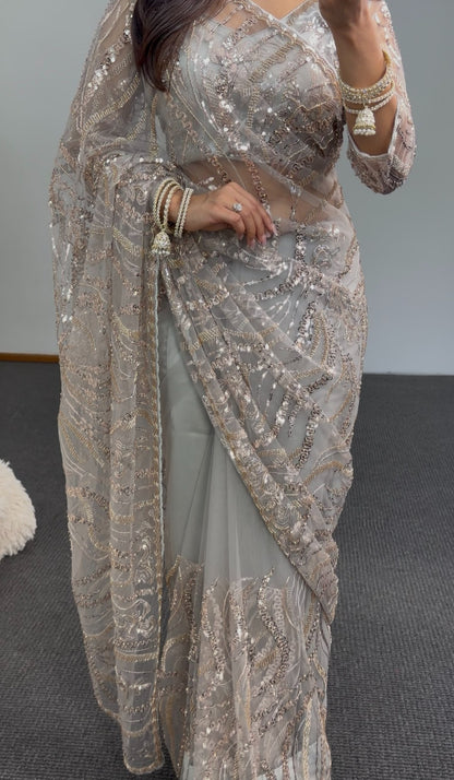 Grey net saree with gold sequin embroidery and embellished pallu draped over matching underskirt — Behuli Australia — view 5