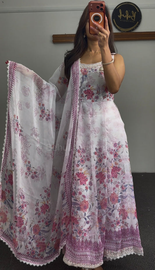 White Anarkali gown with pink floral print, lace trim detailing, and matching printed dupatta by Behuli Australia