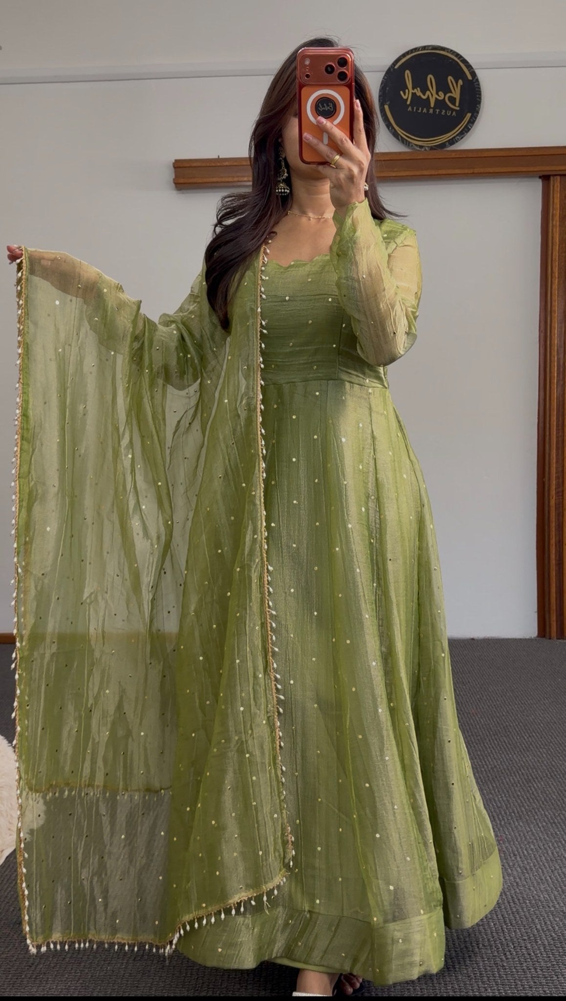 Olive green Anarkali dress with scattered sequin detailing and matching dupatta featuring pearl bead trim