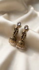 Antique Gold Radha Krishna Jhumka Earrings with Pearls