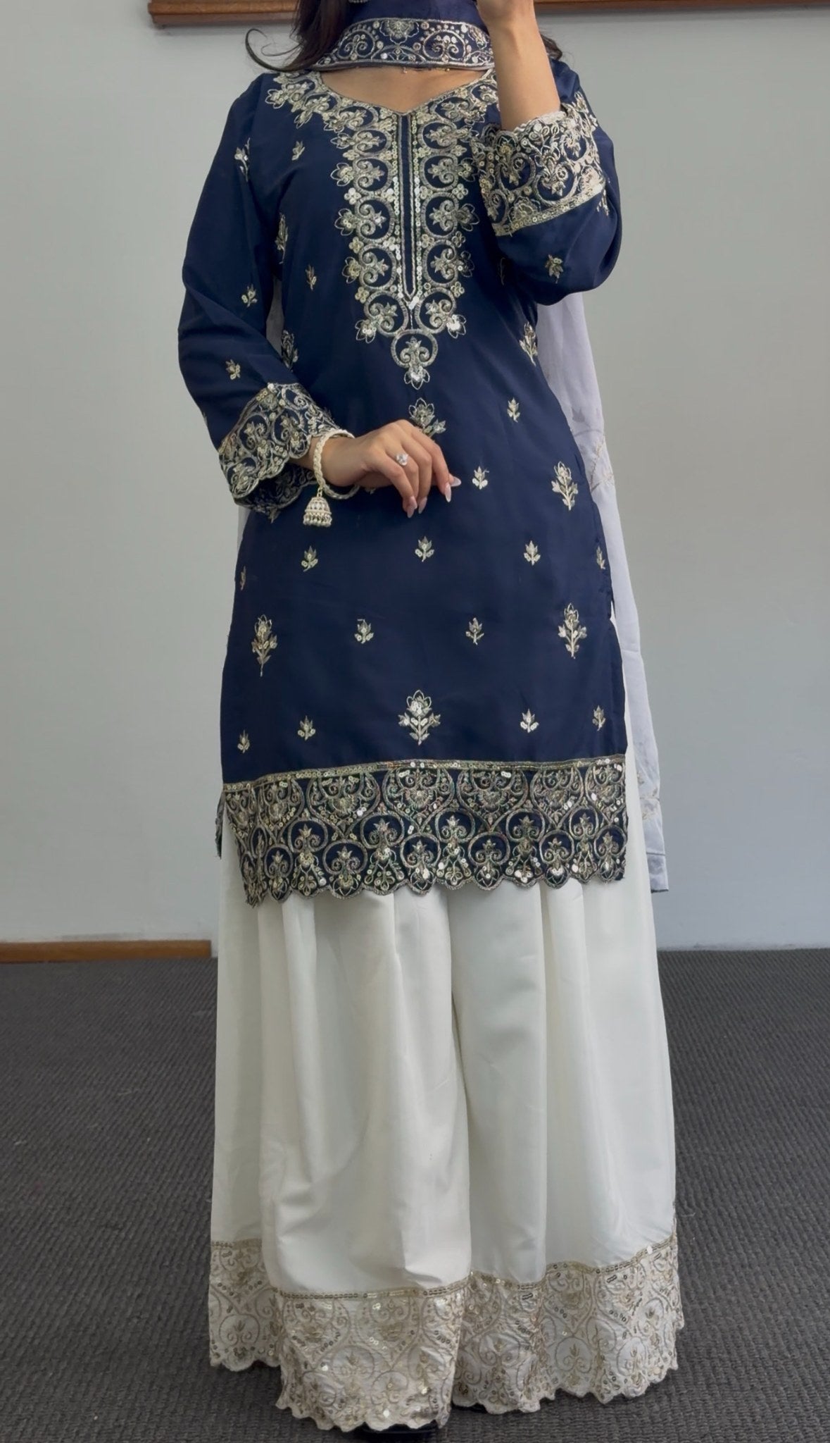 Navy blue palazzo suit set with gold zari embroidery on neckline and hem, paired with white embroidered palazzo pants and — view 2