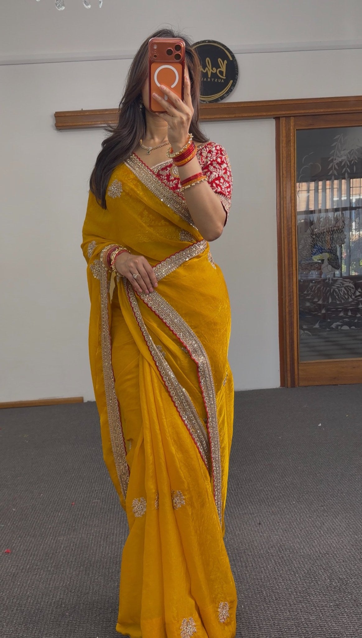 Mustard pure silk saree with gold zari floral embroidery and sequin border, paired with red embroidered blouse — Behuli